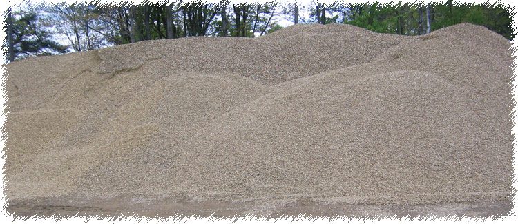 A pile of sand on top of a hill.