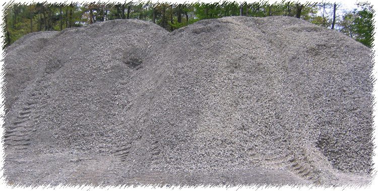 A pile of gravel on top of the ground.