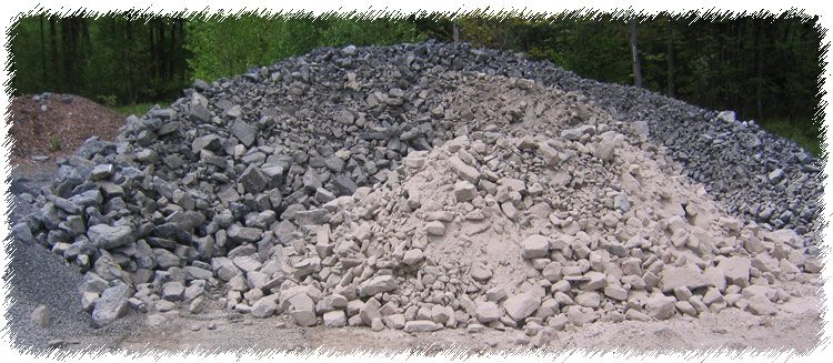 A pile of rocks sitting in the dirt.